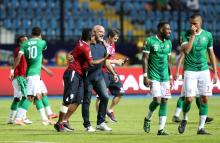 Madagascar coach Nicolas Dupuis celebrates with the players after winning the penalty shootout, Madagascar v DR Congo at Alexandria Stadium, Alexandria, Egypt, July 7, 2019. PHOTO BY REUTERS/Suhaib Salem