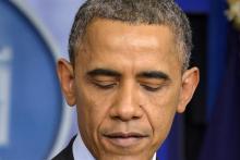 U.S. President Barack Obama pauses as he makes remarks on the passing of former South African President and Nobel Peace Prize Laureate Nelson Mandela at the age of 95, at the White House in Washington