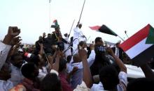 Sudanese President Omar al-Bashir (C) waves to his supporters at the airport in the capital Khartoum, Sudan June 15, 2015, on arrival after attending an African Union conference in Johannesburg South Africa. PHOTO BY REUTERS/Mohamed Nureldin Abdallah