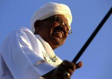 Sudanese President Omar Hassan al-Bashir waves to the crowd during a rally with Sufi supporters in Hajj Yusuf at Khartoum district December 27, 2014. PHOTO BY REUTERS/Mohamed Nureldin Abdallah