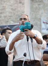 Omar al-Hasi speaks to the crowd during a rally supporting "Fajr Libya" (Operation Dawn), a group of forces mainly from Misrata, at Martyrs' Square in Tripoli September 19, 2014. REUTERS/Ismail Zitouny