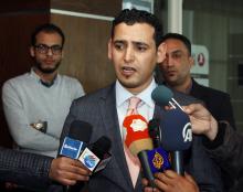 Parliament spokesman Omar Hmeidan speaks during a news conference in Tripoli