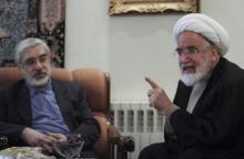 Iranian opposition leader Mirhossein Mousavi (L) meets with pro-reform cleric Mehdi Karoubi in Tehran, October 12, 2009. PHOTO BY REUTERS/Stringer