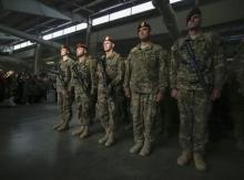 Paratroopers with the 1st Brigade Combat Team, 82nd Airborne Division, stand at attention after returning home from Afghanistan at Pope Army Airfield in Fort Bragg, North Carolina, November 5, 2014. PHOTO BY REUTERS/Chris Keane