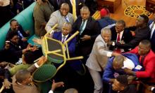 Ugandan lawmakers involve in a fight in the parliament ahead of proposed age limit amendment bill debate a move to change the constitution to extend the president's rule, in Kampala, Uganda September 26, 2017. PHOTO BY REUTERS/James Akena