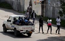 Armed security officers patrol the street during a clash between a Sidama youth and security officers after they declared their own region in Hawassa, Ethiopia July 18, 2019. PHOTO BY REUTERS/Tiksa Negeri