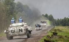 U.N. peacekeepers drive their tank as they patrol past the deserted Kibati village near Goma in the eastern Democratic Republic of Congo