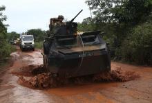 French peacekeepers in an armored vehicle escort a convoy of Muslims fleeing sectarian violence from the capital Bangui towards Bambari