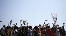 People wave South Sudanese flags as they celebrate referendum results in town of Abyei