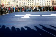 People gather around a giant flag displaying the City of Gdansk coat of arms on the funeral day for the city's mayor Pawel Adamowicz, in Krakow, Poland, January 19, 2019. PHOTO BY REUTERS/Agencja Gazeta/Adrianna Bochenek