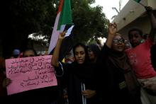 Sudanese people, seeking to revive a push for civilian rule in ongoing tumult since the overthrow of former President Omar al-Bashir more than two months ago, hold banners and march during a demonstration in Khartoum, Sudan, June 27, 2019. PHOTO BY REUTERS/Umit Bektas