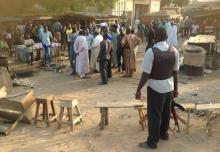 People gather at the scene of a bomb blast at a fruit and vegetable market in the Jimeta area of Yola, Adamawa, Nigeria, November 18, 2015. PHOTO BY REUTERS/Stringer