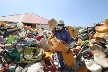 A man sorts plastic litter collected from a garbage dump to be recycled into roofing tiles at the Envirogreen recycling plant in Mogadishu, Somalia, January 13, 2019. PHOTO BY REUTERS/Feisal Omar