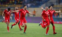 Tunisia players celebrate after winning the match. PHOTO BY REUTERS/Amr Abdallah Dalsh