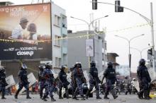 Riot police block a street as police and military forces disperse a procession by Uganda's leading opposition party Forum for Democratic Change supporters with their presidential candidate to a campaign ground, in Kampala, Uganda, February 15, 2016. PHOTO BY REUTERS/James Akena