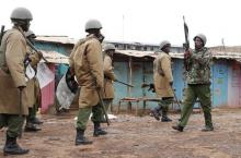 A policeman holds up a rifle after shooting at supporters of opposition leader Raila Odinga in Kawangware slum in Nairobi, Kenya, August 10, 2017. PHOTO BY REUTERS/Goran Tomasevic