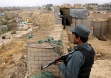 Afghan police officers keep watch at their forward base on the outskirts of Kunduz province, Afghanistan, November 26, 2017. PHOTO BY REUTERS/Nasir Wakif