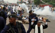 Riot policemen fire tear gas to disperse Catholic priest and demonstrators during a protest against President Joseph Kabila, organized by the Catholic church in Kinshasa, Democratic Republic of Congo, January 21, 2018. PHOTO BY REUTERS/Kenny Katombe