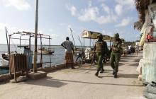 Kenya police officers patrol along the beaches of the Indian Ocean in the coastal town of Lamu