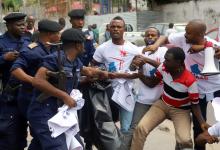 Congolese police officers attempt to disperse members of the Civil Society Action Collective (CASC) chanting slogans as they protest to demand free and fair elections in Kinshasa, Democratic Republic of Congo, September 19, 2018. PHOTO BY REUTERS/Kenny Katombe