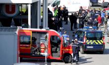 A general view shows gendarmes and police officers at a supermarket after a hostage situation in Trebes, France, March 23, 2018. PHOTO BY REUTERS/Regis Duvignau