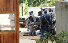 Burundian military and police frisk suspects after they recovered a cache of ammunitions recovered from combatants near Lake Tanganyika in the capital Bujumbura, December 9, 2015. PHOTO BY REUTERS/Jean Pierre Aime Harerimana