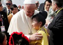 Pope Francis is welcomed as he arrives at Yangon International Airport, Myanmar, November 27, 2017. PHOTO BY REUTERS/Max Rossi