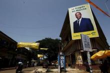 A poster of Guinea's outgoing president and presidential candidate Alpha Conde, leader of Rassemblement du Peuple de Guinea (RPG) is seen at a junction of Kaloum in Conakry, October 8, 2015. PHOTO BY REUTERS/Luc Gnago