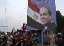 Egyptians celebrate after the swearing-in ceremony of President elect Abdel Fattah al-Sissi, in front of the Presidential Palace in Cairo