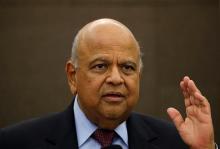 South African Finance Minister Pravin Gordhan reacts during a media briefing in Sandton near Johannesburg, March 14, 2016. PHOTO BY REUTERS/Siphiwe Sibeko