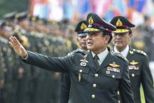 Thailand's Prime Minister Prayuth Chan-ocha waves after a handover ceremony for the new Royal Thai Army Chief, General Udomdej Sitabutr, at the Thai Army Headquarters in Bangkok