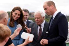 Britain's Prince William, Catherine, Duchess of Cambridge and Sir David Attenborough look at ice core from the Antarctic as they attend the naming of the RRS Sir David Attenborough polar research ship at Camel Laird shipyard, Birkenhead, Britain, September 26, 2019. PHOTO BY REUTERS/Asadour Guzelian