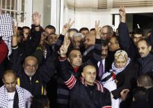 Palestinian President Mahmoud Abbas (C) welcomes Palestinian prisoners released from Israeli prisons in the West Bank city of Ramallah