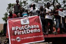 Demonstrators carry banners during a protest in Ghana's capital Accra against the expansion of its defence cooperation with the United States, Ghana, March 28, 2018. PHOTO BY REUTERS/Francis Kokoroko
