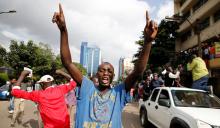 Kenyan opposition Coalition of Reform and Democracy (CORD) supporters protest at the premises hosting the headquarters of Independent Electoral and Boundaries Commission (IEBC) to demand the disbandment of the electoral body ahead of next year's election in Nairobi, Kenya, May 23, 2016. PHOTO BY REUTERS/Thomas Mukoya