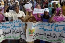 Mauritanian anti-slavery protesters march to demand the liberation of imprisoned abolitionist leader Biram Ould Abeid in Nouakchott, May 26, 2012. Security forces used tear gas to break up the protesters. Slavery still exists in some parts of Mauritania despite a 2007 law banning the practice. PHOTO BY REUTERS/Joe Penney