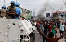Residents chant slogans against Congolese President Joseph Kabila as peacekeepers serving in the United Nations Organization Stabilization Mission in the Democratic Republic of the Congo (MONUSCO) patrol during demonstrations in the streets of the Democratic Republic of Congo's capital Kinshasa, December 20, 2016. PHOTO BY REUTERS/Thomas Mukoya