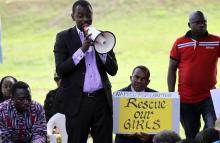 A protester addresses a sit-in rally in support of the release of the abducted Chibok schoolgirls, at the Unity Fountain in Abuja