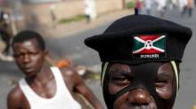 A masked protester stands during a protest against Burundi President Pierre Nkurunziza and his bid for a third term in Bujumbura, Burundi, May 21, 2015. PHOTO BY REUTERS/Goran Tomasevic