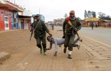 Congolese soldiers arrest a civilian protesting against the government's failure to stop the killings and inter-ethnic tensions in the town of Butembo, in North Kivu province, Democratic Republic of Congo, August 24, 2016. PHOTO BY REUTERS/Kenny Katombe