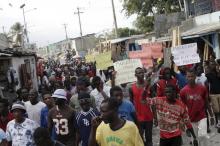 Protesters march during a demonstration against the government in Port-au-Prince, Haiti, January 25, 2016. PHOTO BY REUTERS/Andres Martinez Casares