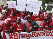 Nigerians take part in a protest demanding for the release of secondary school girls abducted from the remote village of Chibok, in Asokoro, Abuja