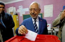 Rached Ghannouchi, head of the Ennahda party, casts his vote at a polling station for the municipal election in Tunis, Tunisia, May 6, 2018. PHOTO BY REUTERS/Zoubeir Souissi