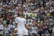 Rafael Nadal of Spain reacts after defeating Lukas Rosol of the Czech Republic in their men's singles tennis match at the Wimbledon Tennis Championships, in London