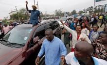 Kenyan opposition leader Raila Odinga, of the National Super Alliance (NASA) coalition, waves to supporters as he leaves the St. Stephen's cathedral after attending a church service in Nairobi, Kenya, September 3, 2017. PHOTO BY REUTERS/Thomas Mukoya