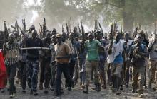 Rebel fighters gather in a village in Upper Nile State