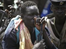 Rebel fighters listen to their commander in a rebel-controlled territory in Upper Nile State