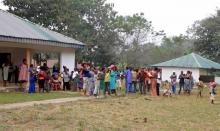 A still image taken from a video shot on December 9, 2017 shows Cameroonian refugees standing outside a center in Agbokim Waterfalls village, which borders on Cameroon, Nigeria. PHOTO BY REUTERS