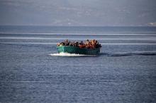 Refugees and migrants arrive on an overcrowded boat on the Greek island of Lesbos, November 10, 2015. PHOTO BY REUTERS/Alkis Konstantinidis