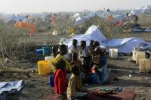 South Sudanese refugees wait inside a camp 10 km (6 miles) from al-Salam locality at the border of Sudan's White Nile state, after arriving from Malakal and al-Rank war zones within South Sudan, January 27, 2014. PHOTO BY REUTERS/Mohamed Nureldin Abdallah